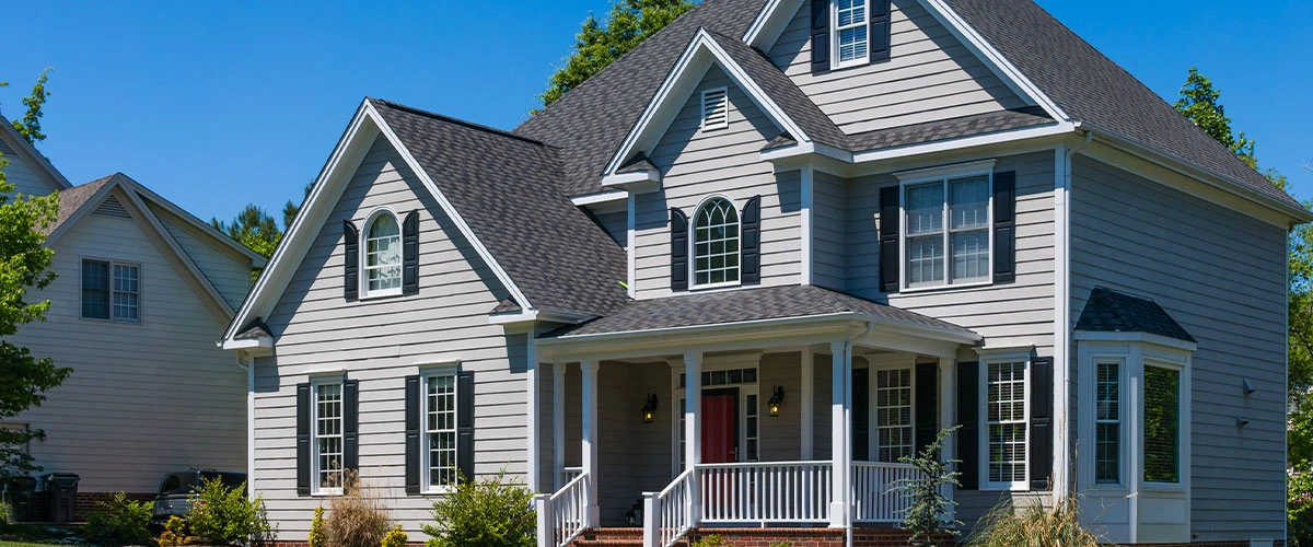 Freshly painted home exterior with gray siding and white trim, EG Contracting in Fairfax, VA