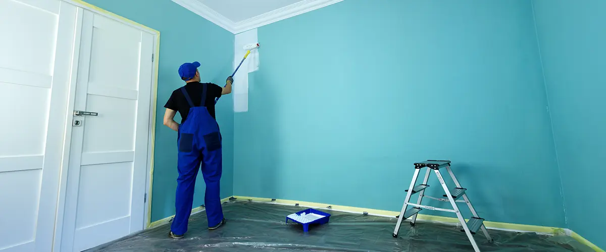 A contractor offering tips for painting a painting an interior wall in blue