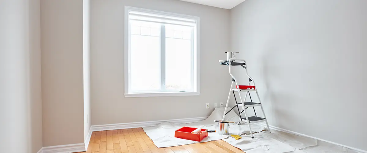 Interior painting with red tray and wood flooring
