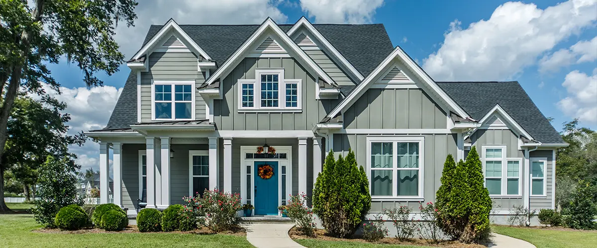 Home siding with light green vinyl