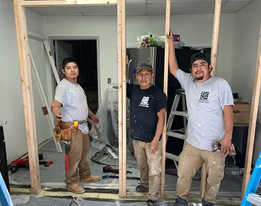 EG Contracting Services crew members posing at a job site