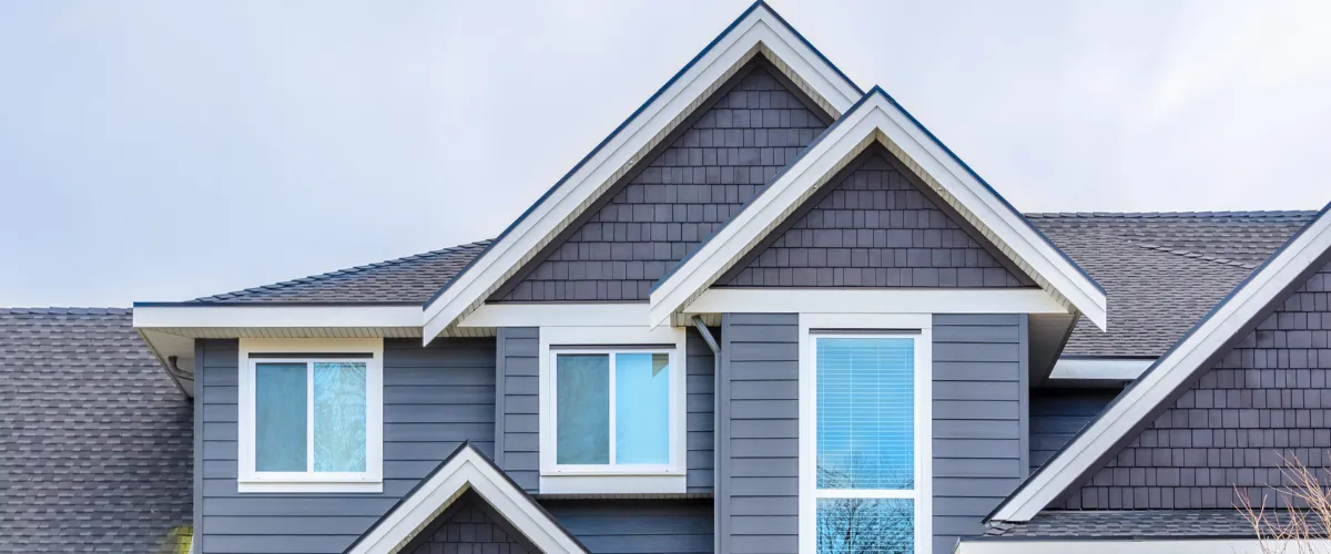 Modern house exterior with gray siding and white trim