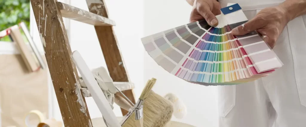 Paint color samples and brushes prepared for exterior painting