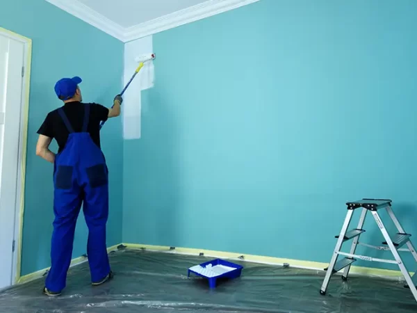 A contractor offering tips for painting a painting an interior wall in blue